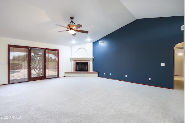 unfurnished living room with vaulted ceiling, ceiling fan, and carpet floors