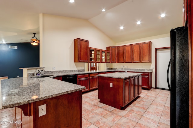 kitchen featuring black appliances, kitchen peninsula, vaulted ceiling, sink, and ceiling fan