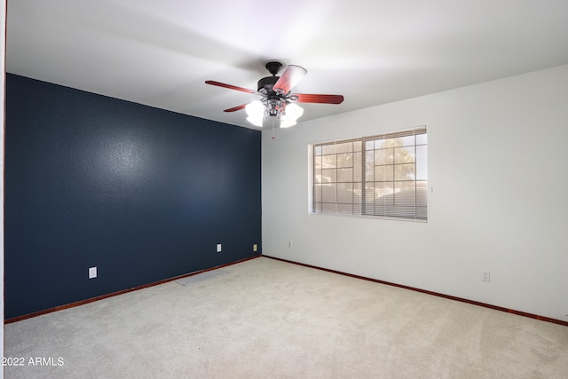 unfurnished room with ceiling fan and carpet floors