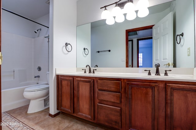 full bathroom with washtub / shower combination, tile flooring, toilet, and double sink vanity