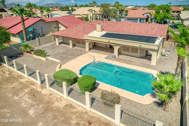 view of swimming pool with a patio