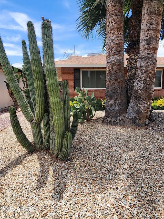 9939 W Ironwood Dr, Sun City, AZ 85351 - view of side of home with brick siding