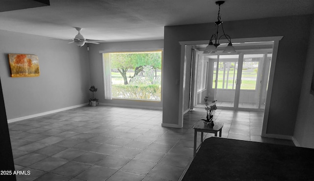 9939 W Ironwood Dr, Sun City, AZ 85351 - dining area with plenty of natural light, dark tile patterned flooring, and a ceiling fan
