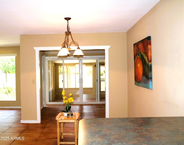 9939 W Ironwood Dr, Sun City, AZ 85351 - tiled dining area with french doors and baseboards