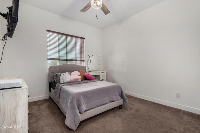 bedroom with ceiling fan and dark carpet