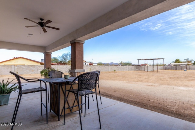 view of patio with ceiling fan