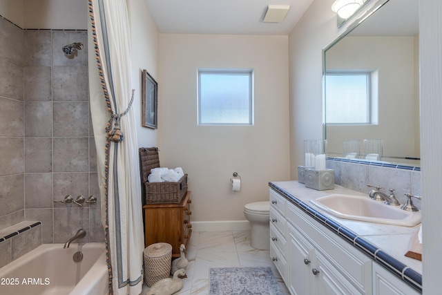 full bathroom featuring toilet, vanity, and shower / bath combo with shower curtain