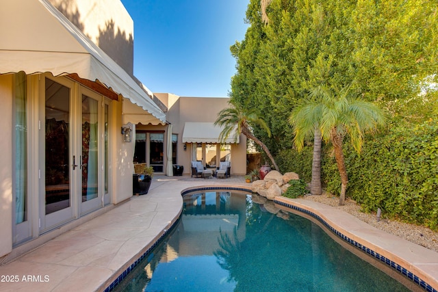 view of swimming pool featuring a patio area