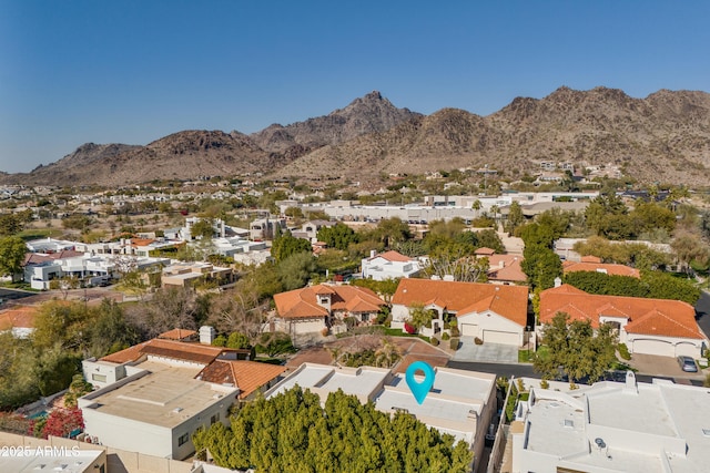 birds eye view of property featuring a mountain view