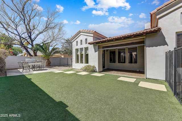 exterior space with a patio and fence