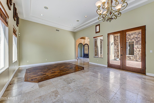 entryway featuring arched walkways, french doors, recessed lighting, visible vents, and baseboards