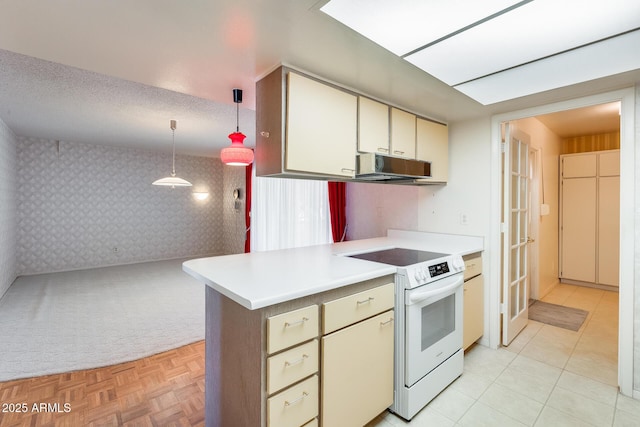 15608 N 57th Dr, Glendale, AZ 85306 - kitchen with white electric stove, wallpapered walls, exhaust hood, light countertops, and decorative light fixtures