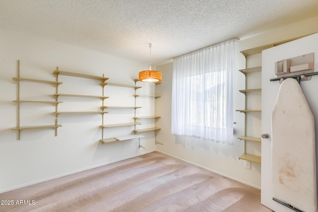 15608 N 57th Dr, Glendale, AZ 85306 - unfurnished dining area with a textured ceiling and carpet floors