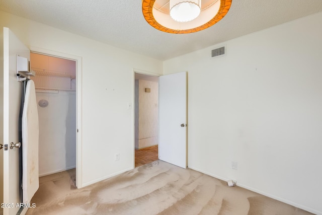 15608 N 57th Dr, Glendale, AZ 85306 - unfurnished bedroom with light colored carpet, a closet, and a spacious closet