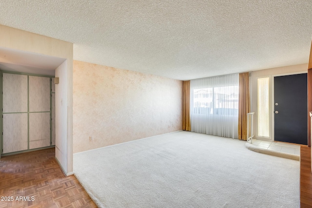 15608 N 57th Dr, Glendale, AZ 85306 - empty room featuring a textured ceiling and carpet floors