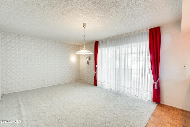 15608 N 57th Dr, Glendale, AZ 85306 - unfurnished room featuring a textured ceiling, carpet, and wallpapered walls