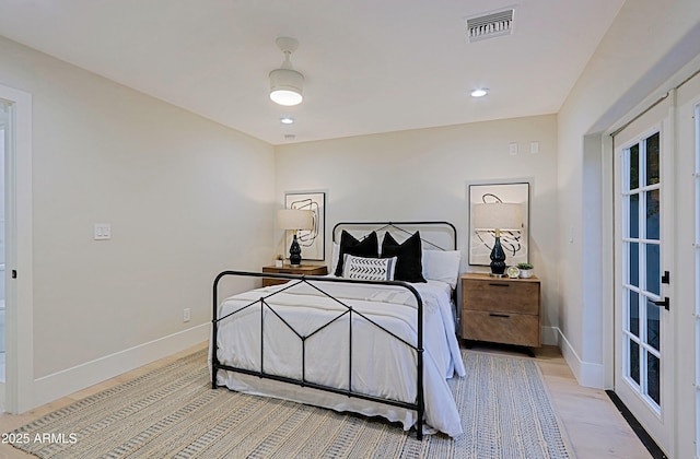18 W Kaler Dr, Phoenix, AZ 85021 - bedroom with baseboards, light wood finished floors, and french doors