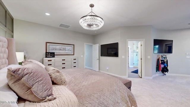 bedroom featuring a chandelier and light carpet