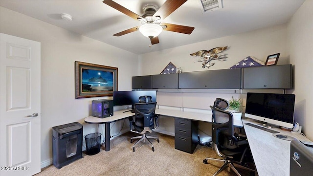 office with light colored carpet and ceiling fan