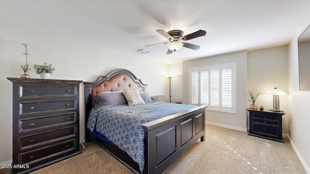 bedroom with light colored carpet and ceiling fan