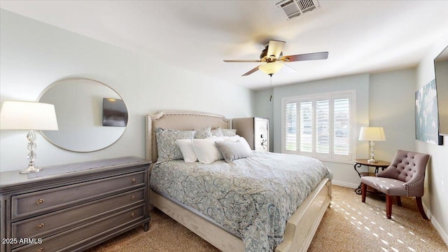 bedroom featuring light colored carpet and ceiling fan