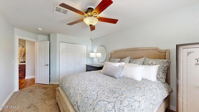 carpeted bedroom featuring ceiling fan and a closet