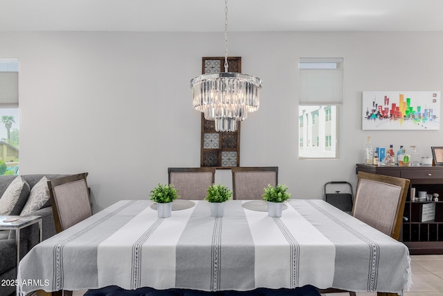 dining room with a chandelier and light tile patterned flooring