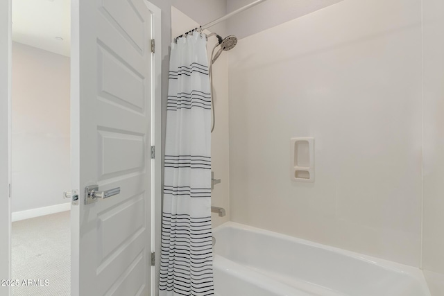 bathroom featuring shower / bath combo with shower curtain