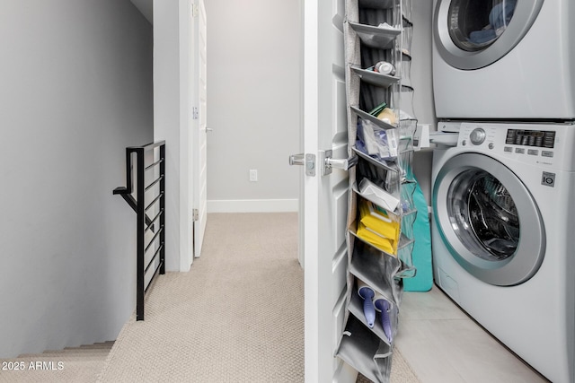 laundry room featuring stacked washer / dryer and light colored carpet
