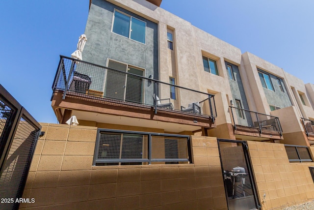 view of building exterior with fence