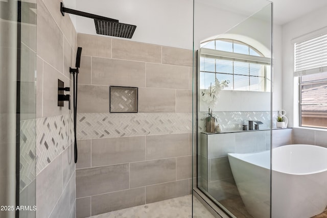 bathroom with shower with separate bathtub