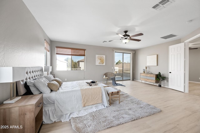 bedroom with access to exterior, ceiling fan, and light wood-type flooring