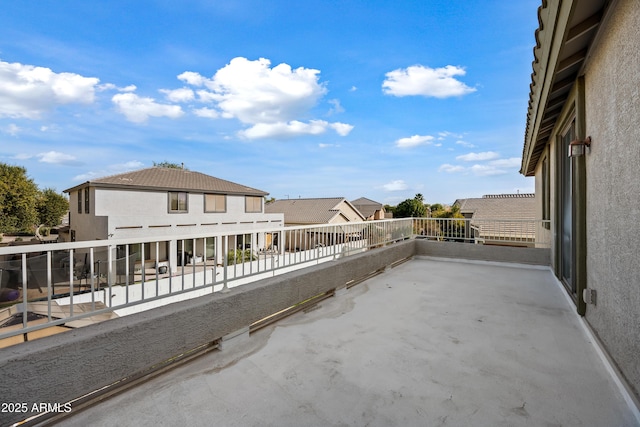 view of patio featuring a balcony