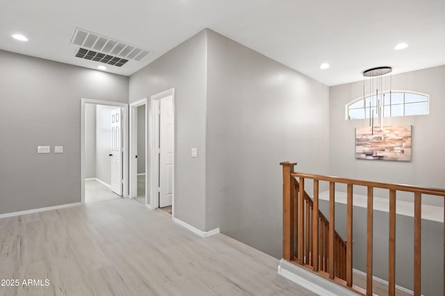 hall with light hardwood / wood-style flooring