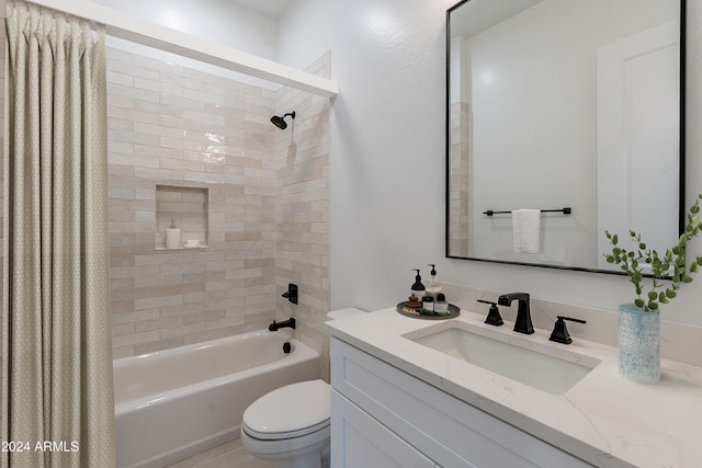 full bathroom with vanity, toilet, and shower / bath combo with shower curtain