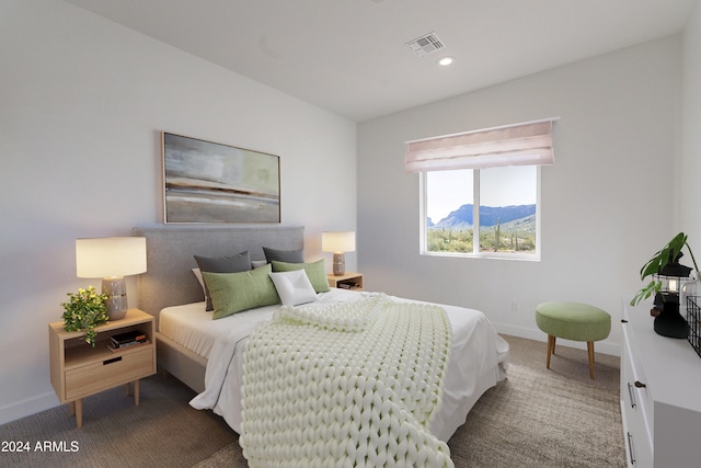 bedroom with carpet flooring and a mountain view