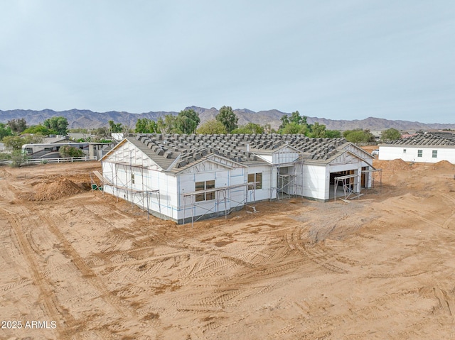 exterior space with a mountain view and an outdoor structure