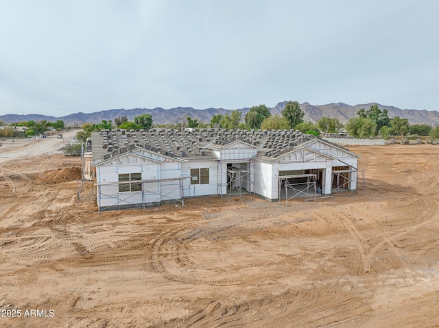 exterior space with a mountain view and an outdoor structure