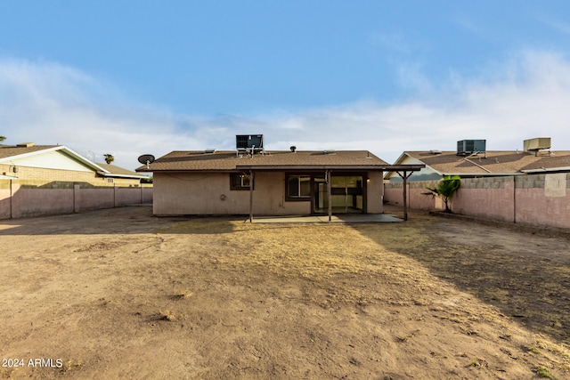 back of house featuring central AC and a patio area