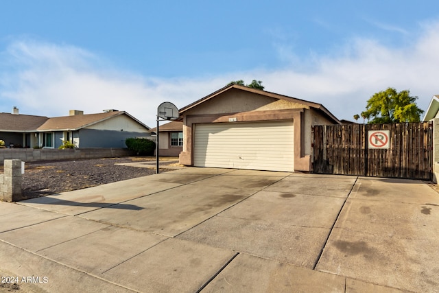 ranch-style house featuring a garage