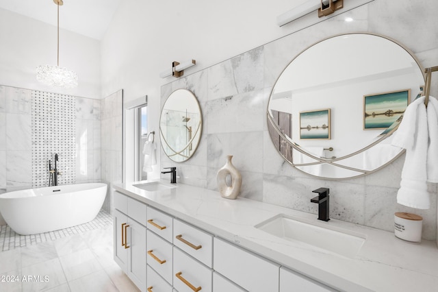 bathroom featuring a soaking tub, double vanity, a sink, and tile walls