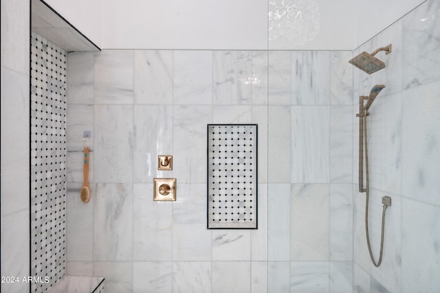 full bathroom with a tile shower