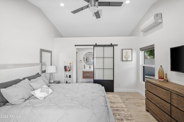 bedroom featuring baseboards, a barn door, a wall mounted air conditioner, light wood finished floors, and recessed lighting