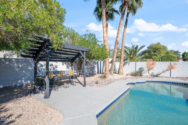 view of swimming pool featuring a pergola, a patio area, a fenced backyard, and a fenced in pool