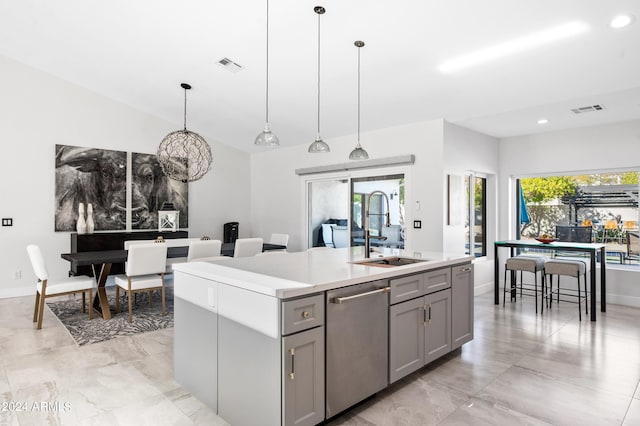 kitchen with gray cabinets, dishwasher, a sink, and visible vents