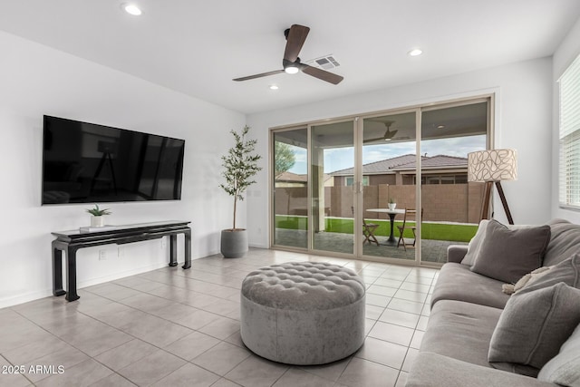 tiled living area with visible vents, recessed lighting, baseboards, and a ceiling fan