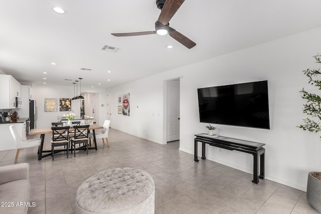 living room with recessed lighting, visible vents, baseboards, and ceiling fan