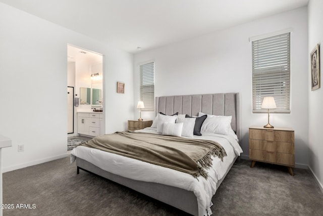 bedroom featuring baseboards, carpet floors, and ensuite bathroom