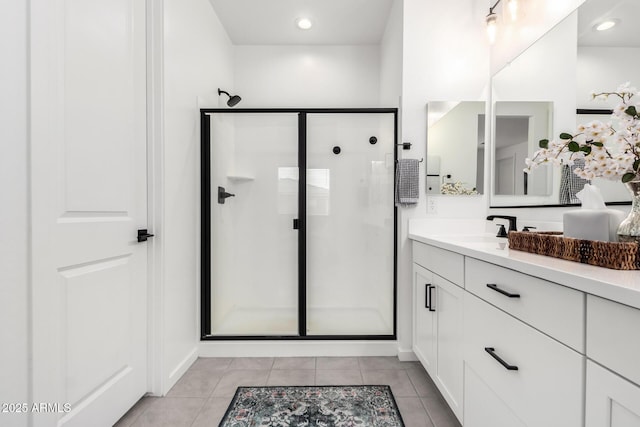 full bath with tile patterned floors, vanity, recessed lighting, and a shower stall