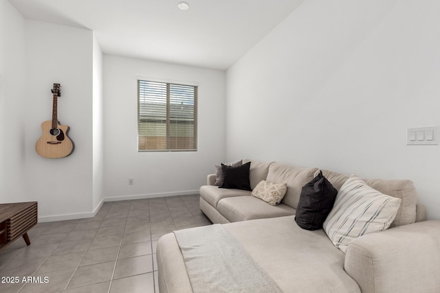 living room featuring light tile patterned floors and baseboards